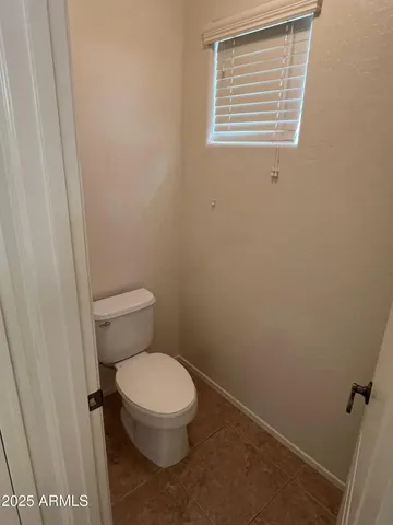 a view of wooden door and brick wall