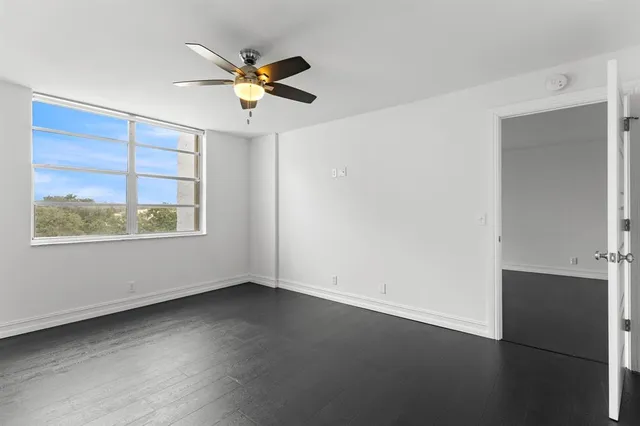 a view of an empty room with a window