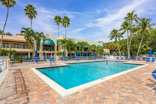 a view of a swimming pool with a patio