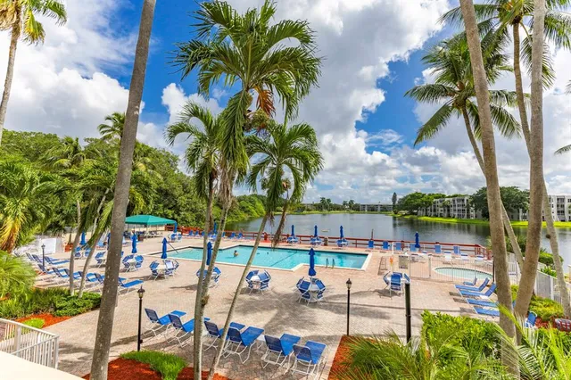 a view of swimming pool with outdoor seating
