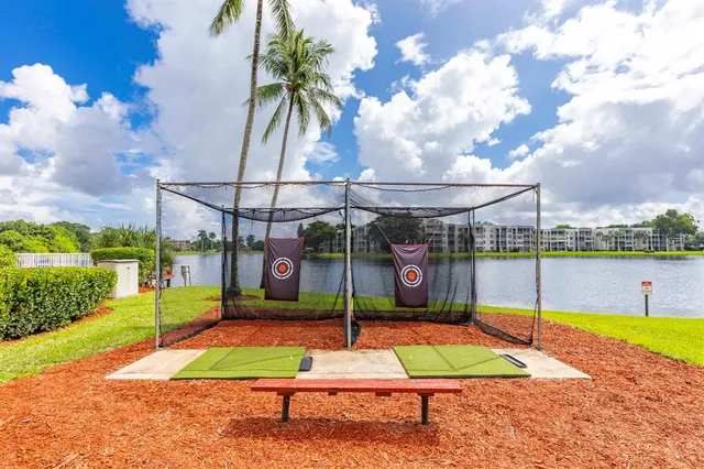 a view of a park with iron fence