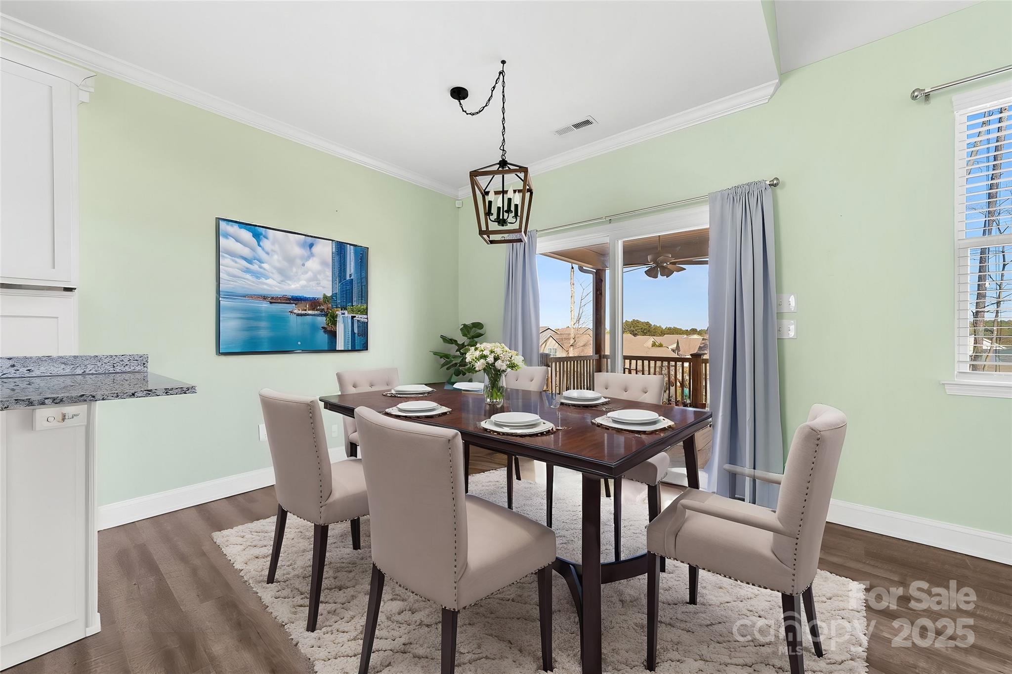 7617 Red Robin Trail Denver, NC 28037 - Photo 17 of 38 a view of a dining room with furniture window and wooden floor