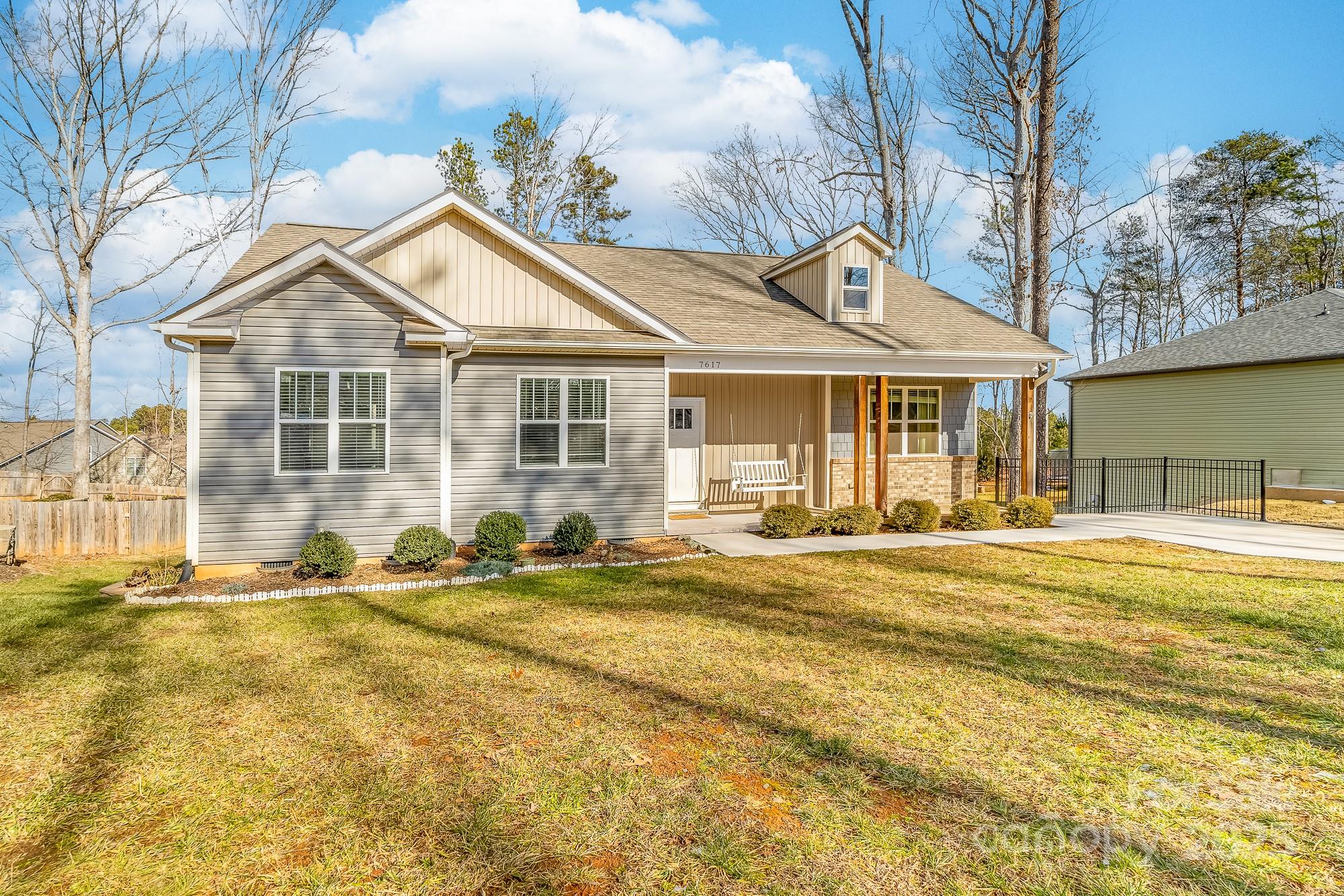 7617 Red Robin Trail Denver, NC 28037 - Photo 2 of 38 a front view of a house with a yard outdoor seating and garage