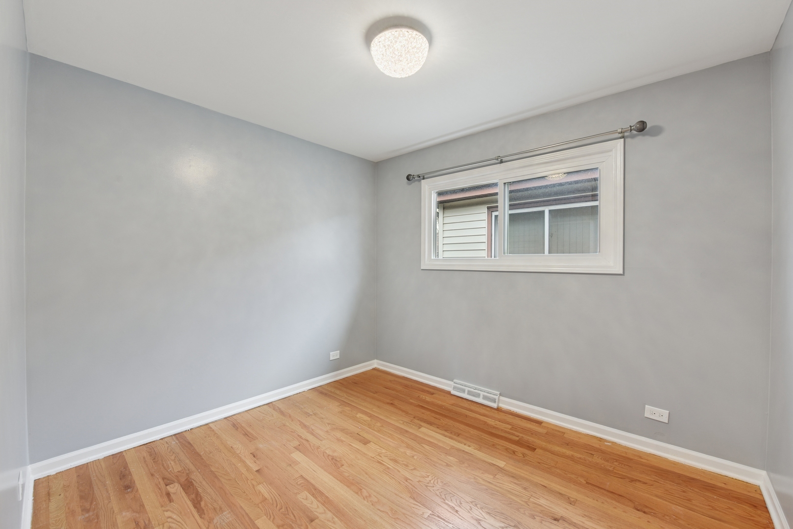 5829 Madison Street Morton Grove, IL 60053 - Photo 14 of 28 a view of empty room with wooden floor