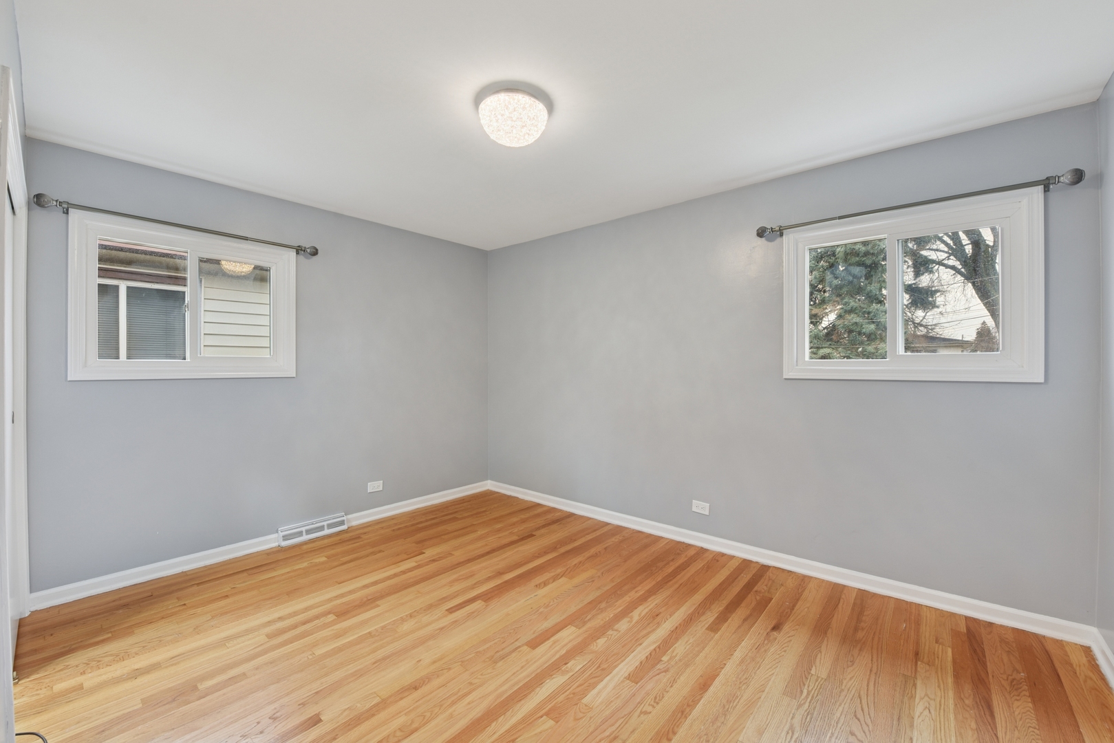 5829 Madison Street Morton Grove, IL 60053 - Photo 18 of 28 a view of empty room with wooden floor