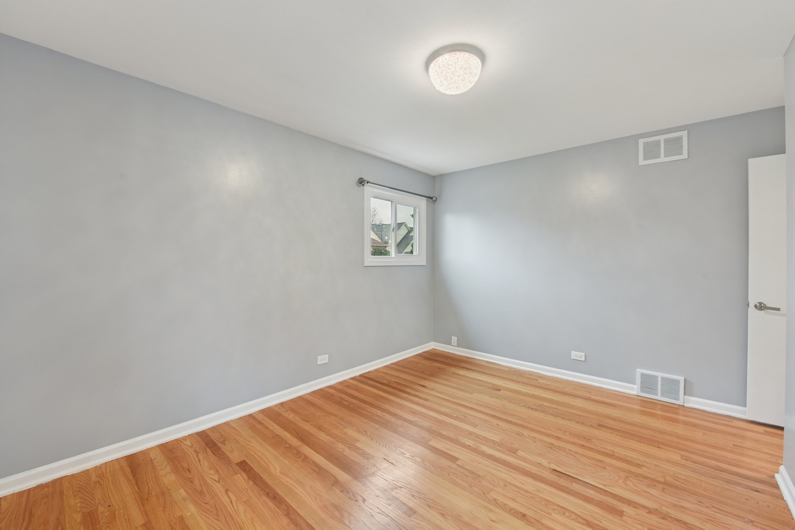 5829 Madison Street Morton Grove, IL 60053 - Photo 19 of 28 an empty room with a window