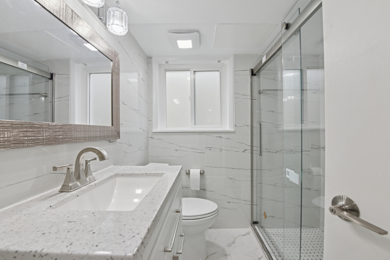 5829 Madison Street Morton Grove, IL 60053 - Photo 6 of 28 a bathroom with a sink a toilet and shower