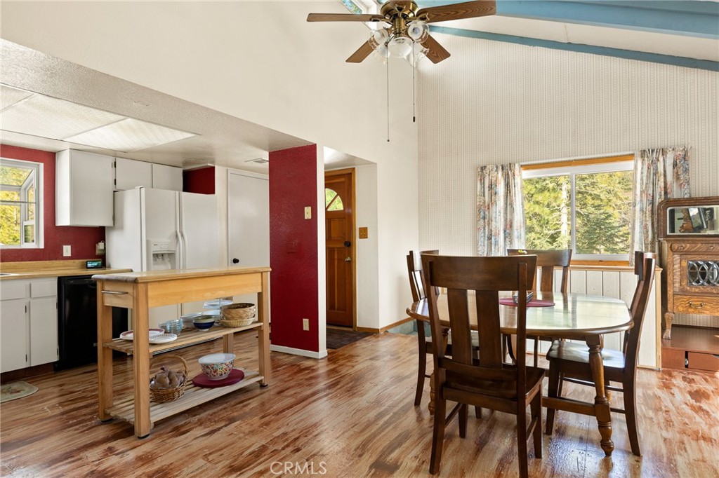 337 Lookout Drive Twin Peaks, CA 92391 - Photo 9 of 32 a view of a dining room with furniture window and wooden floor
