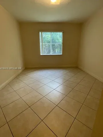 a view of a room that has a window in it