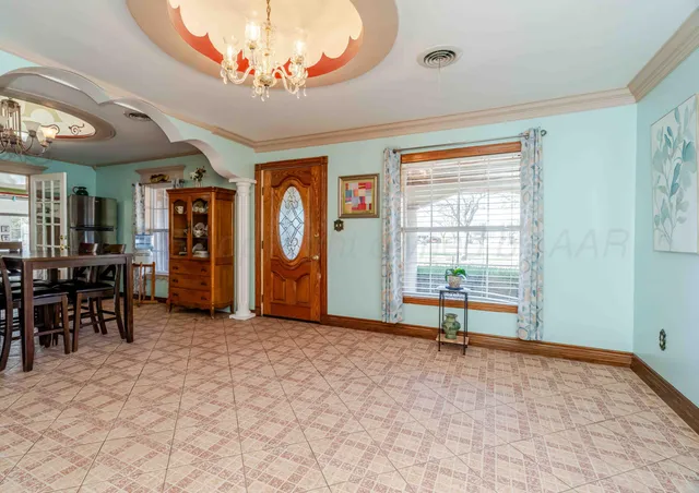 a view of a livingroom with furniture and a window