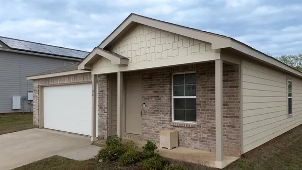 a front view of a house with garage