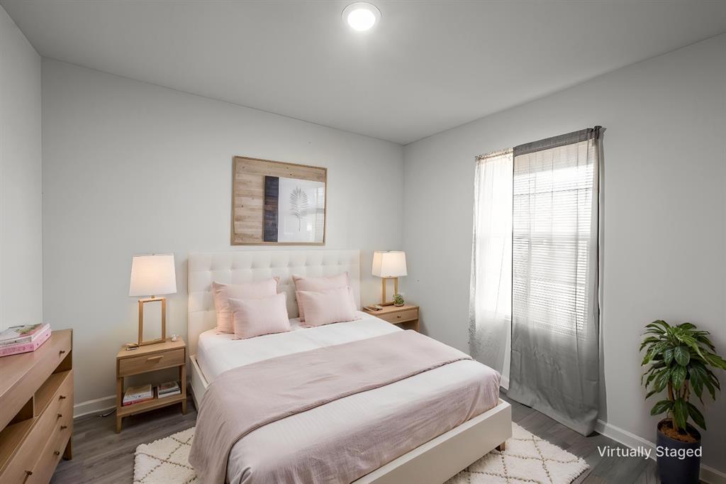 1106 Ripplewood Circle Chandler, TX 75758 - Photo 11 of 24 a bedroom with a bed and a potted plant