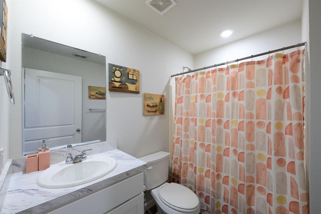 1106 Ripplewood Circle Chandler, TX 75758 - Photo 15 of 24 a bathroom with a sink toilet and shower