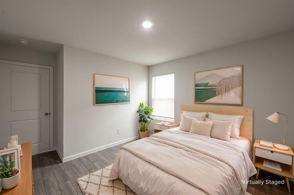 1106 Ripplewood Circle Chandler, TX 75758 - Photo 16 of 24 a bedroom with a bed and wooden floor