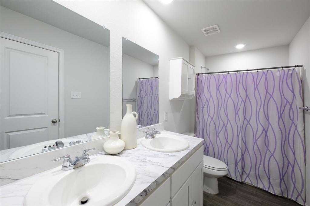 1106 Ripplewood Circle Chandler, TX 75758 - Photo 21 of 24 a bathroom with a sink and a mirror