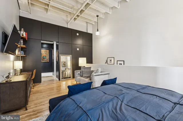 a bed room with a bed and cabinets