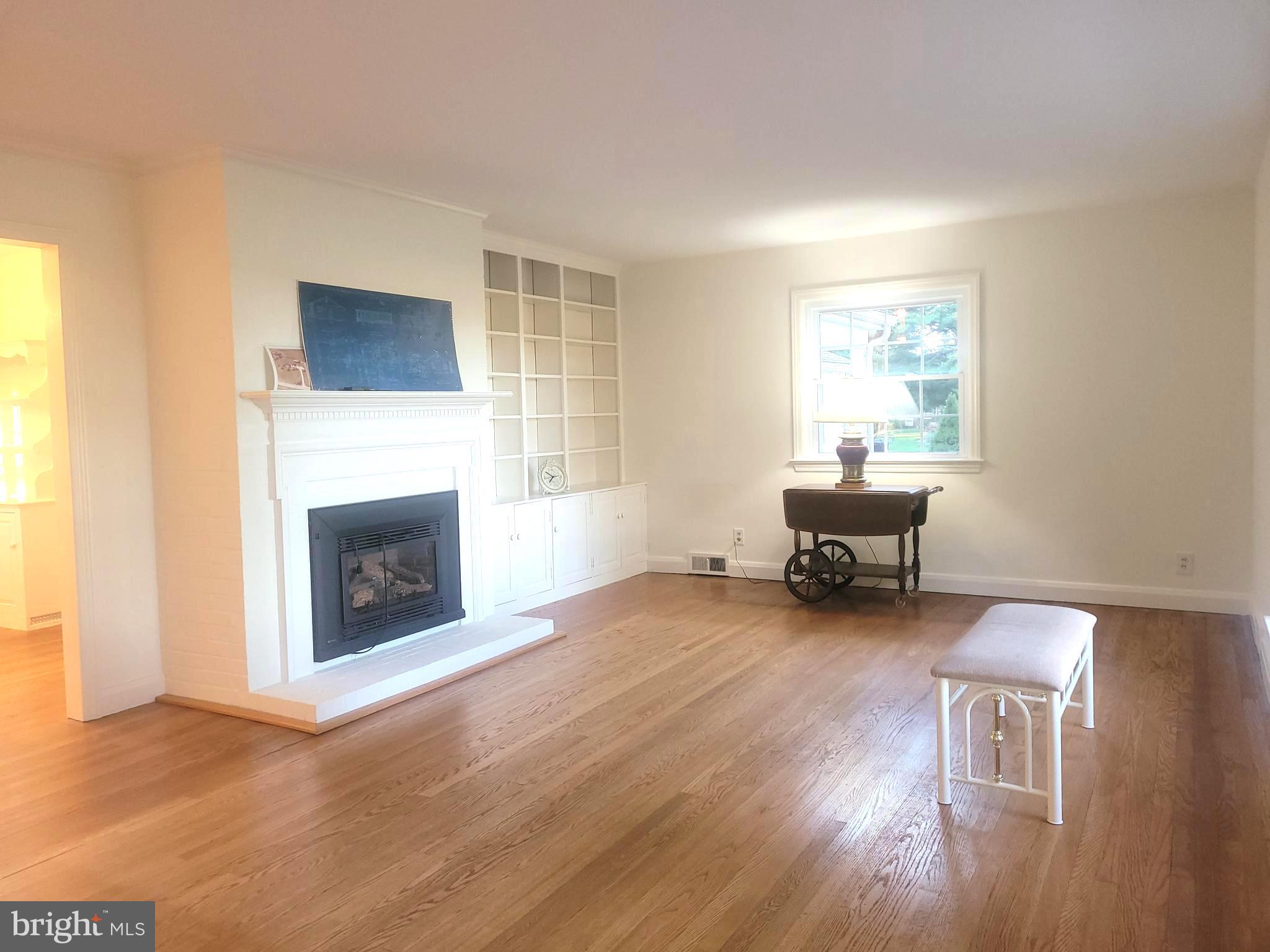 715 Sullivan Road Westminster, MD 21157 - Photo 2 of 59 a living room with furniture and a fireplace