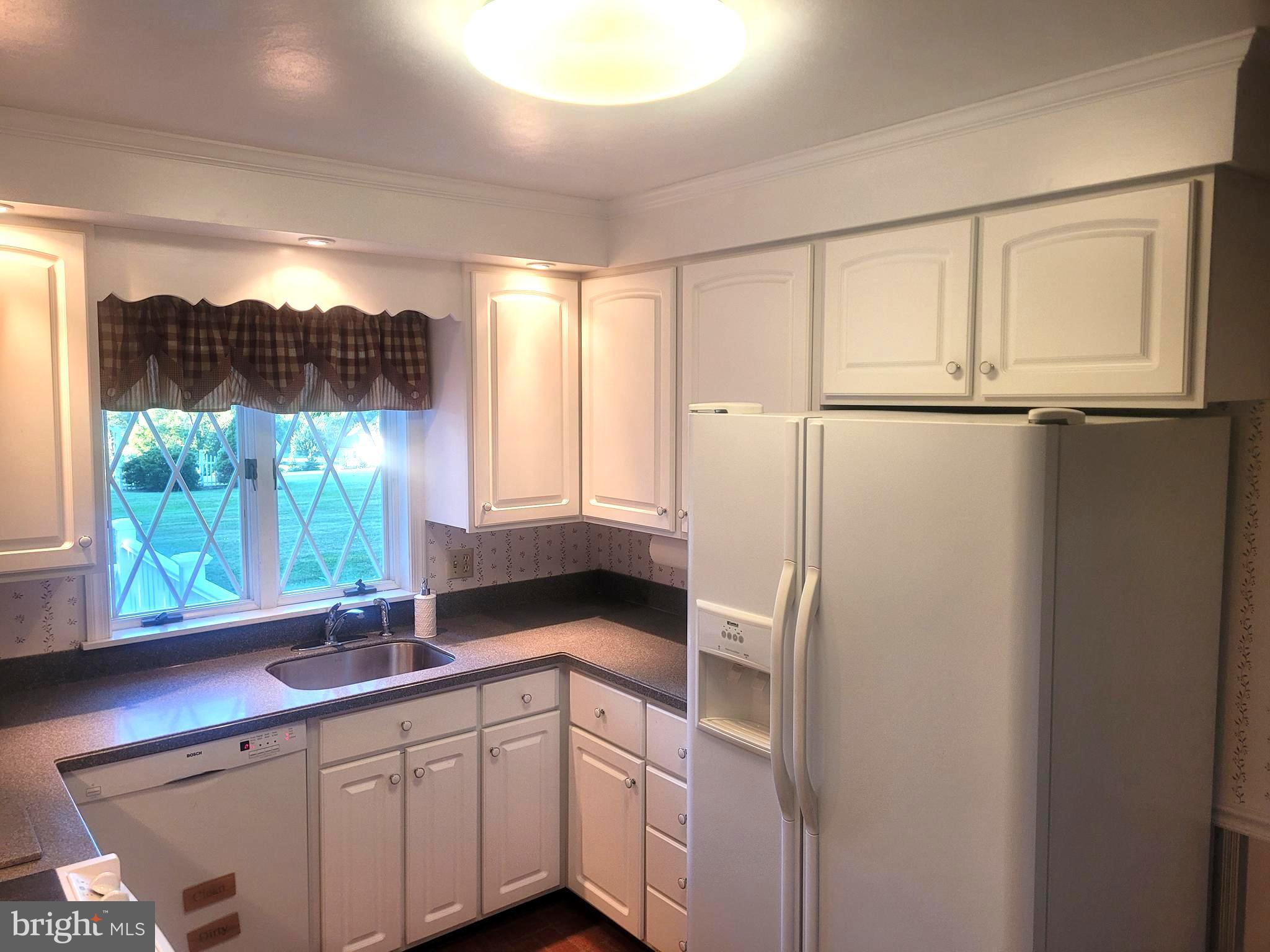 715 Sullivan Road Westminster, MD 21157 - Photo 26 of 59 a kitchen with a sink and a window