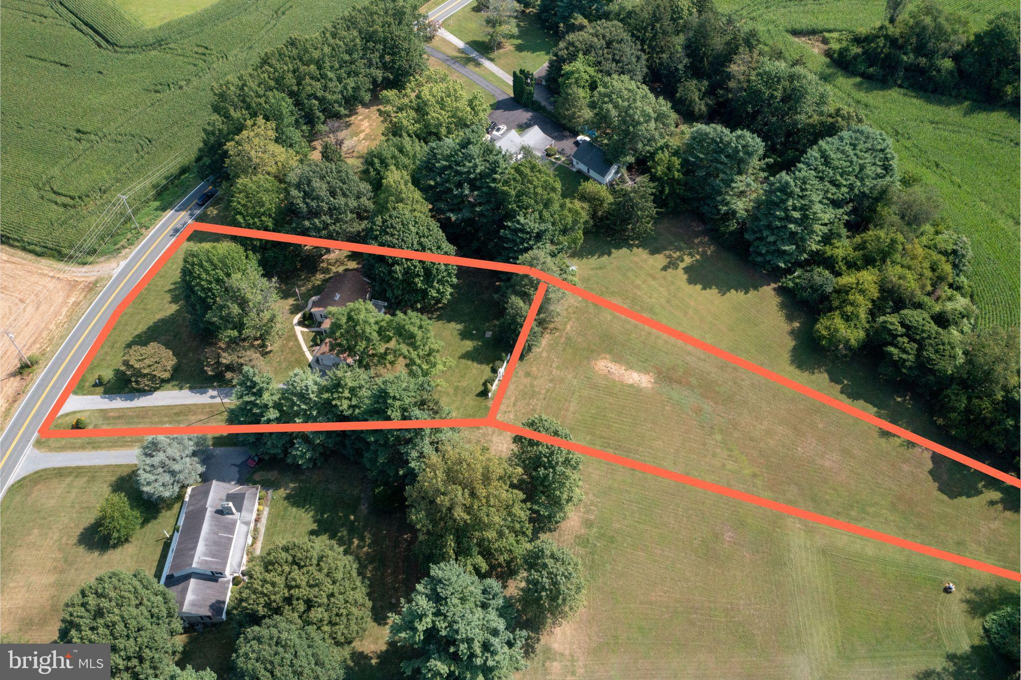 715 Sullivan Road Westminster, MD 21157 - Photo 4 of 59 Spacious land with lush greenery and roads.