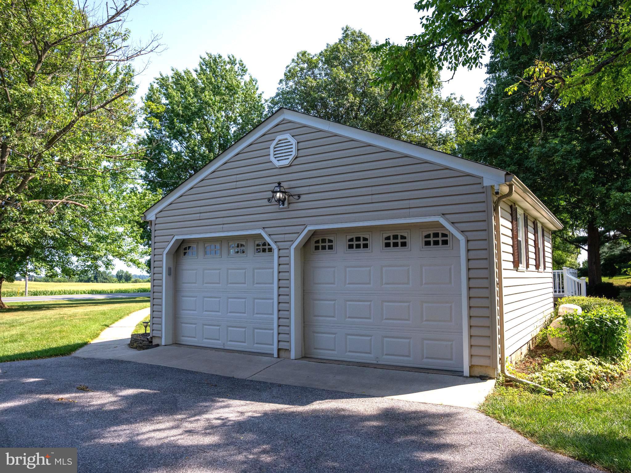 715 Sullivan Road Westminster, MD 21157 - Photo 6 of 59 a view of a small house with a small yard and large tree