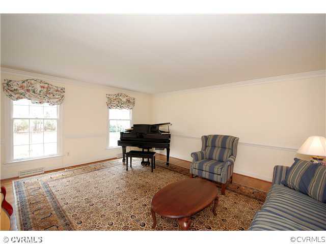 Living Room - The FORMAL LIVING ROOM has hardwood