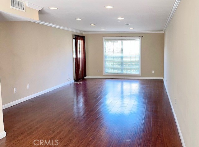 585 West Duarte Road, Unit 29 Arcadia, CA 91007 - Photo 3 of 13 a view of an empty room with wooden floor and a window