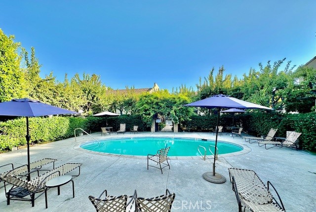 585 West Duarte Road, Unit 29 Arcadia, CA 91007 - Photo 6 of 13 a table and chair under an umbrella