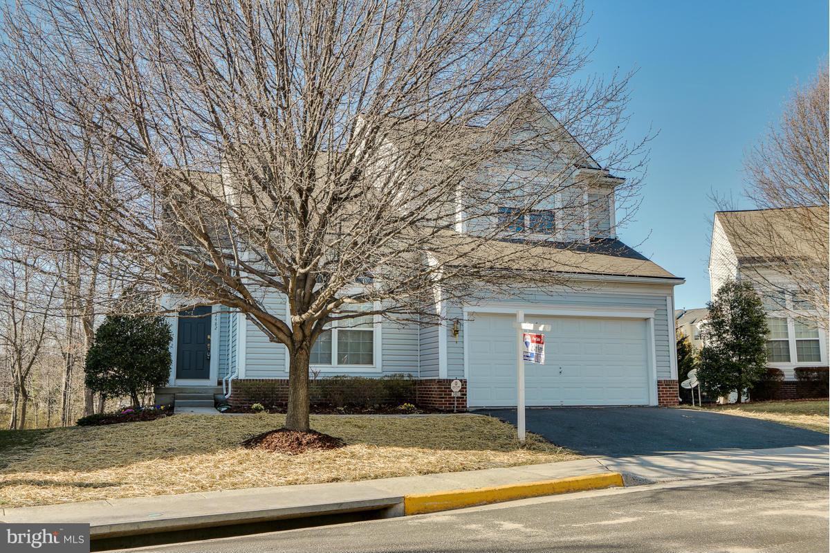 2482 Leyland Ridge Road Herndon, VA 20171 - Photo 1 of 29 a house that has a tree in front of it