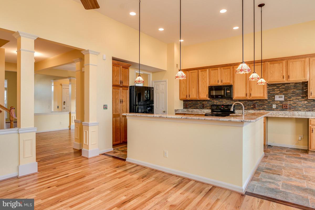 2482 Leyland Ridge Road Herndon, VA 20171 - Photo 11 of 29 a kitchen with stainless steel appliances a refrigerator sink and microwave