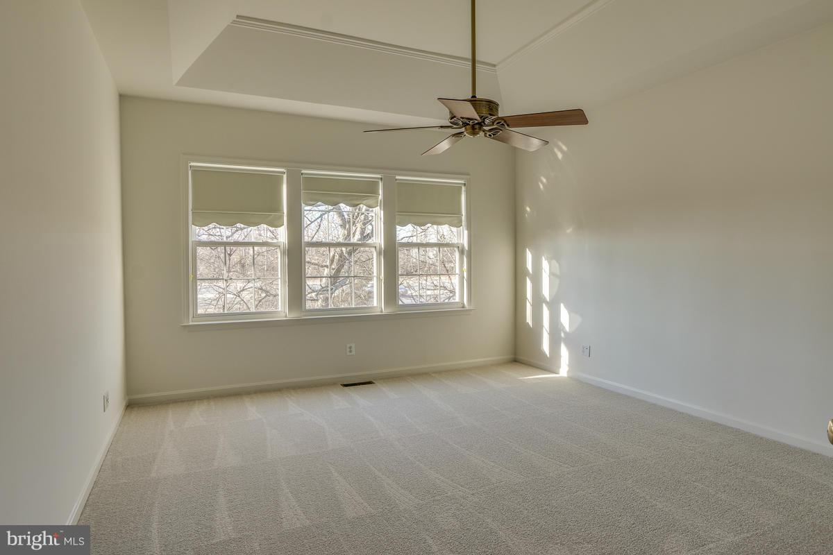 2482 Leyland Ridge Road Herndon, VA 20171 - Photo 13 of 29 an empty room with a window and a fan
