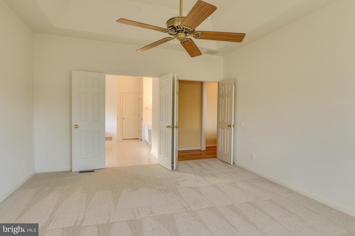 2482 Leyland Ridge Road Herndon, VA 20171 - Photo 14 of 29 a view of a livingroom with a ceiling fan and window