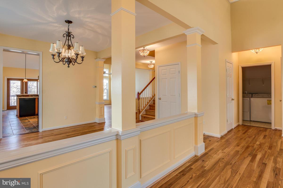 2482 Leyland Ridge Road Herndon, VA 20171 - Photo 3 of 29 a view of a hallway with wooden floor and staircase