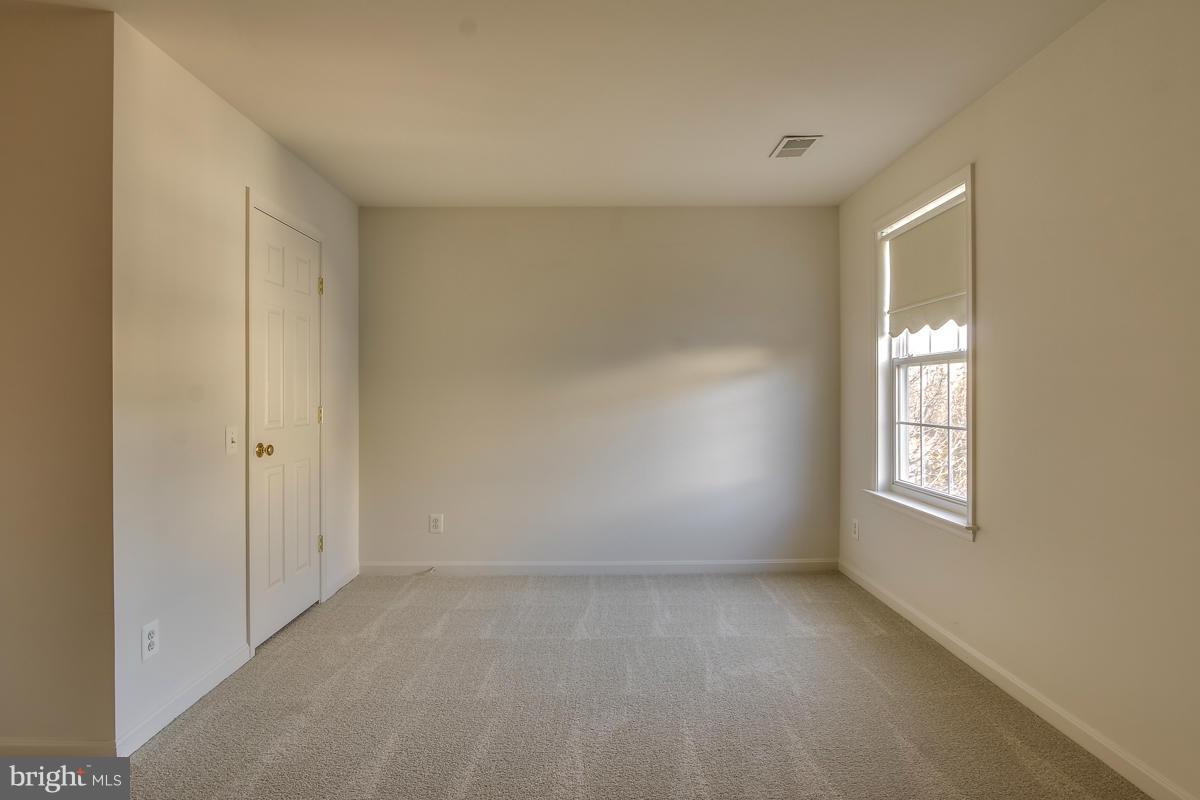 2482 Leyland Ridge Road Herndon, VA 20171 - Photo 23 of 29 a view of an empty room with windows
