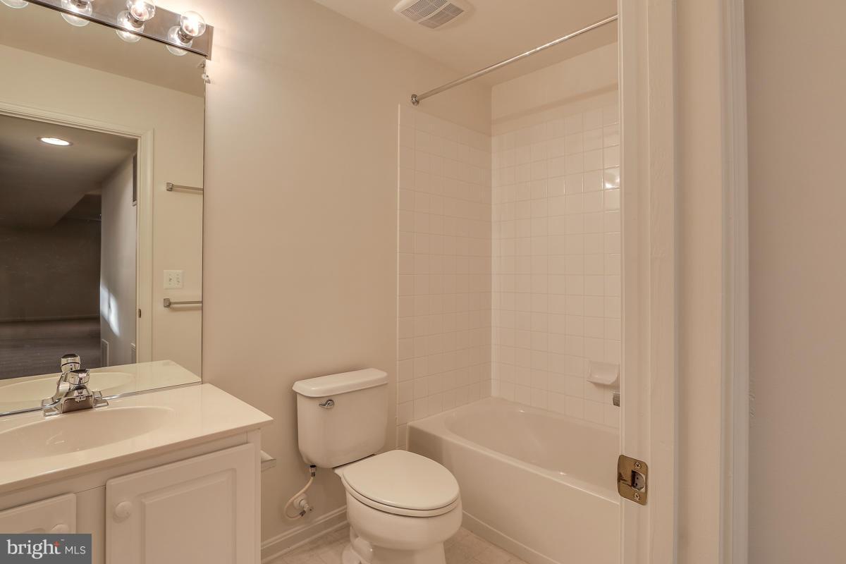 2482 Leyland Ridge Road Herndon, VA 20171 - Photo 28 of 29 a bathroom with a sink a toilet and shower