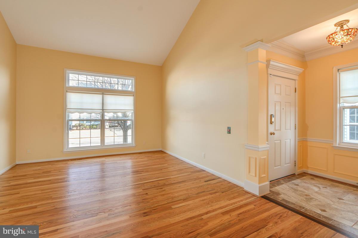 2482 Leyland Ridge Road Herndon, VA 20171 - Photo 4 of 29 a view of an empty room with wooden floor and a window