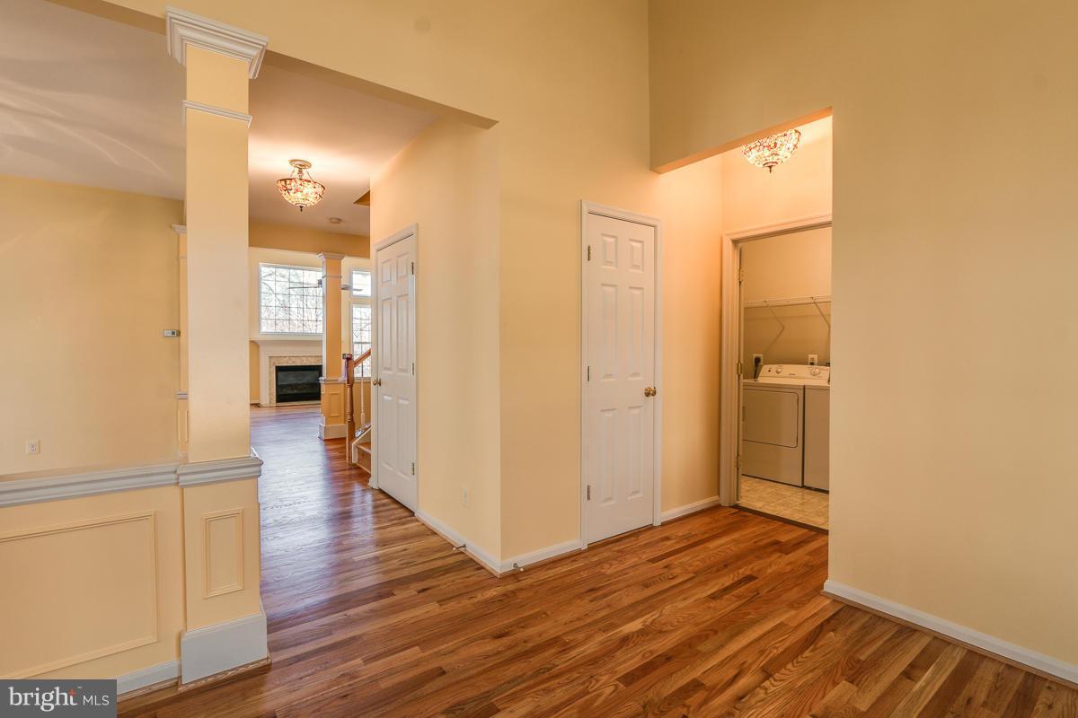 2482 Leyland Ridge Road Herndon, VA 20171 - Photo 5 of 29 a view of a hallway with wooden floor