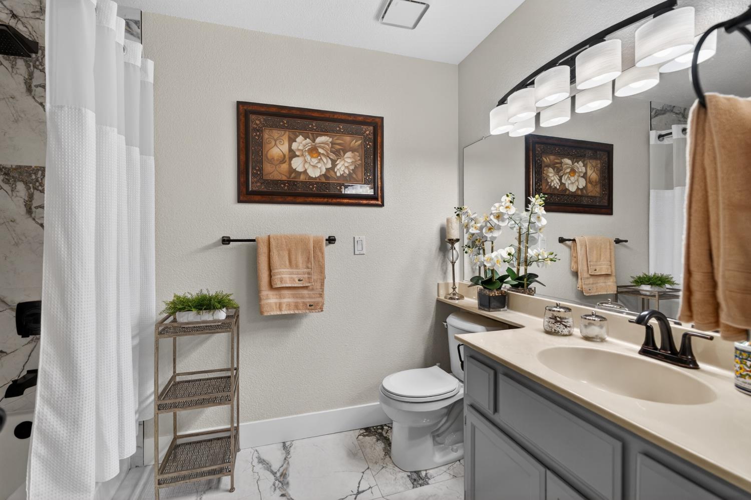 8020 Walerga Road, Unit 1140 Antelope, CA 95843 - Photo 18 of 37 a bathroom with a toilet a sink and mirror