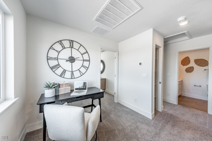 5882 Grand Row Way Reno, NV 89523 - Photo 12 of 19 a living room with a table and a mirror