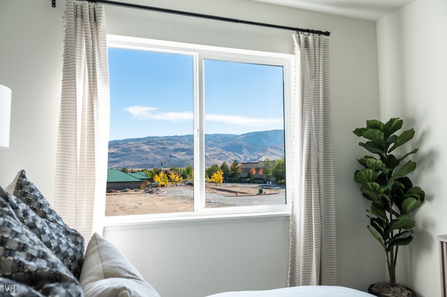 5882 Grand Row Way Reno, NV 89523 - Photo 15 of 19 a living room with furniture and a potted plant