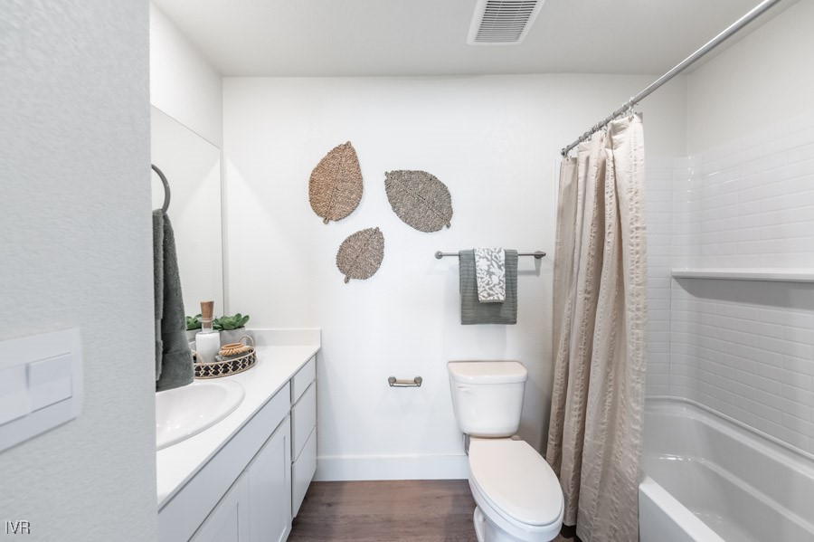 5882 Grand Row Way Reno, NV 89523 - Photo 17 of 19 a bathroom with a toilet a sink and mirror