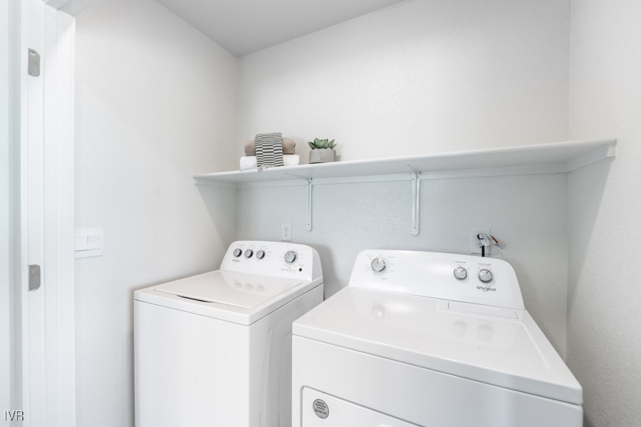 5882 Grand Row Way Reno, NV 89523 - Photo 18 of 19 a utility room with dryer and washer