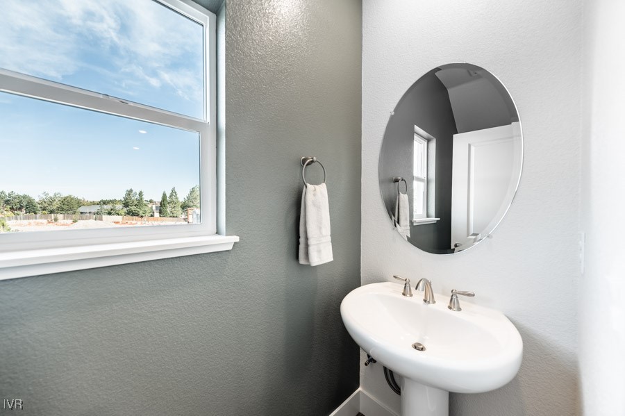 5882 Grand Row Way Reno, NV 89523 - Photo 19 of 19 a bathroom with a sink and a mirror
