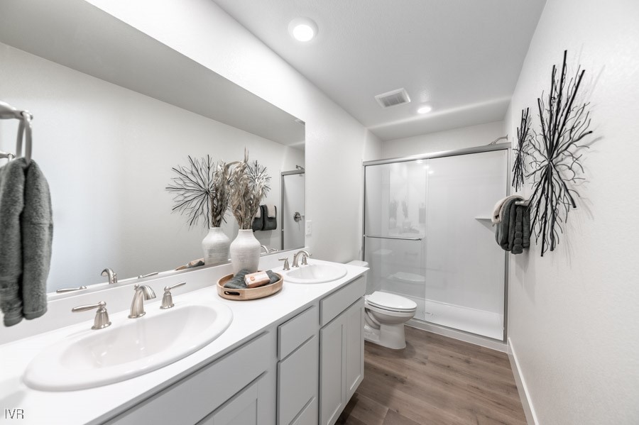 5882 Grand Row Way Reno, NV 89523 - Photo 10 of 19 a bathroom with a double vanity sink toilet and shower