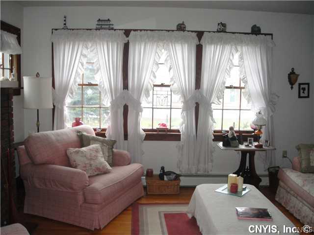 76 Utica Street Hamilton, NY 13346 - Photo 4 of 16 Living Room Hardwoods and wood trims prevail-