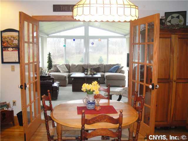 76 Utica Street Hamilton, NY 13346 - Photo 9 of 16 Family Room From Kitchen enjoy sunny family room!