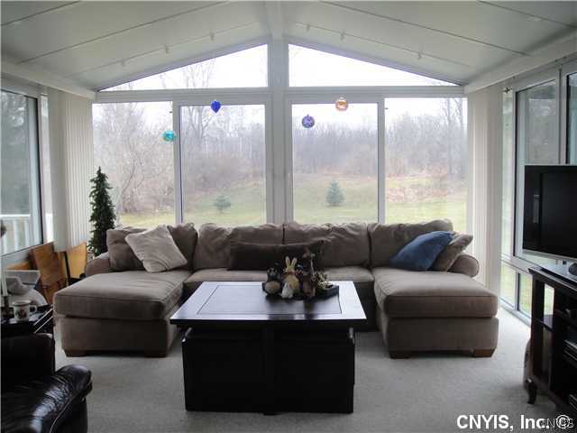 76 Utica Street Hamilton, NY 13346 - Photo 10 of 16 Family Room Wrapped up with big glass, this 15 X 2