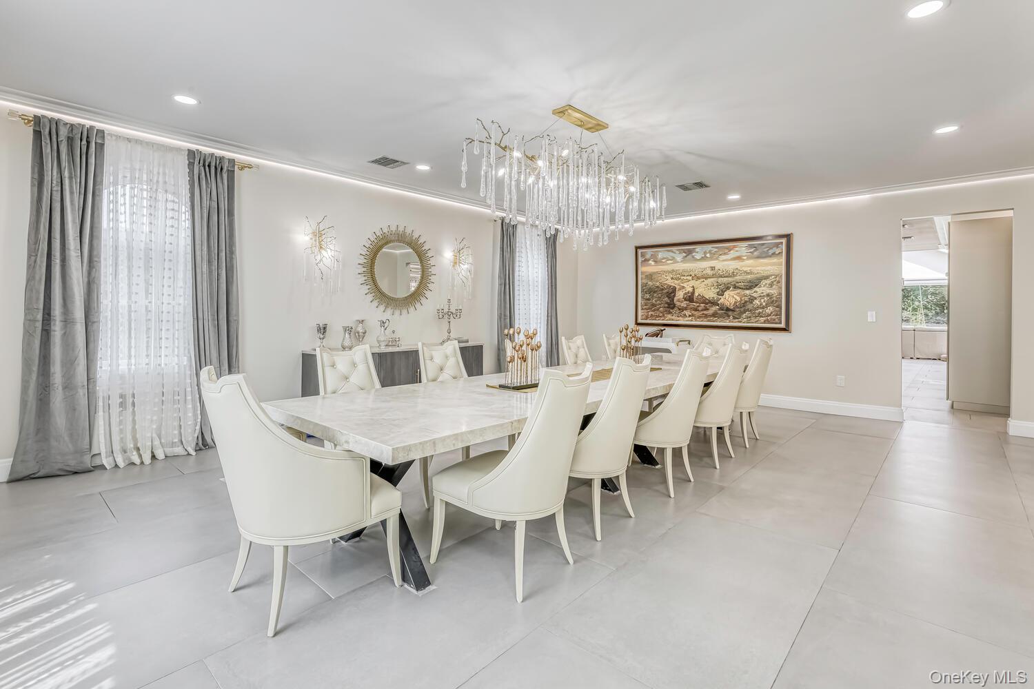 4 Cortland Road Monsey, NY 10952 - Photo 23 of 29 a dining room with furniture a chandelier and wooden floor