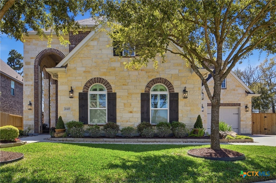 2427 Anderson Point Lane Spring, TX 77388 - Photo 4 of 47 a front view of a house with garden