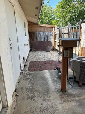 a view of a chairs and table in the balcony