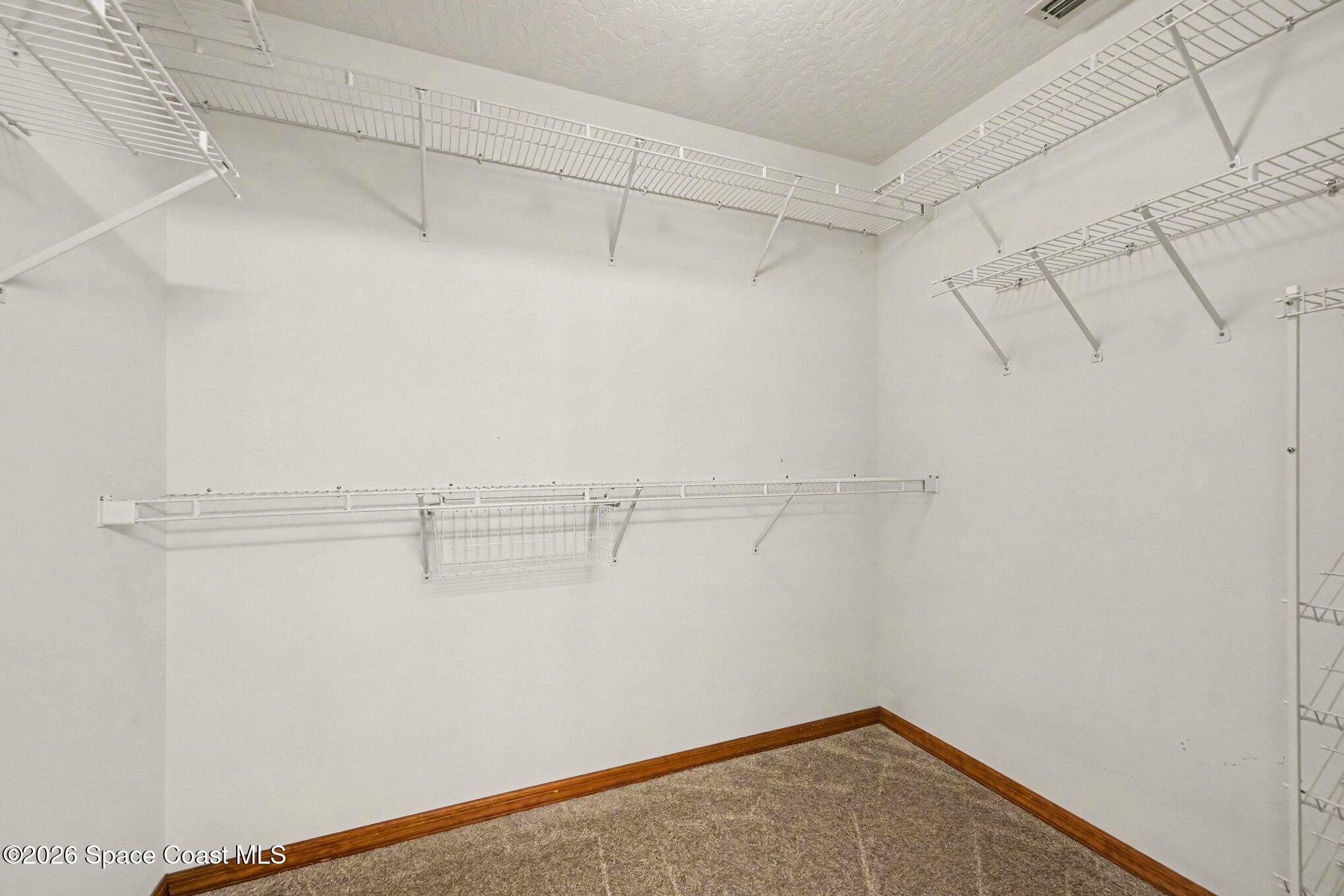 899 Ridge Lake Drive Melbourne, FL 32940 - Photo 16 of 34 a view of a room with racks on the wall